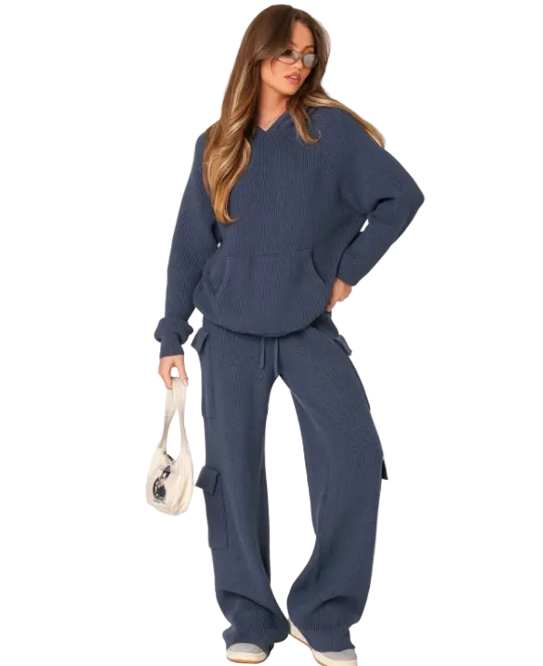 Woman wearing a navy blue lounge set on a white background